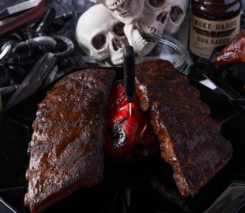 In this BBQ ideas for your Halloween party we see a dead man chest made with smoked ribs