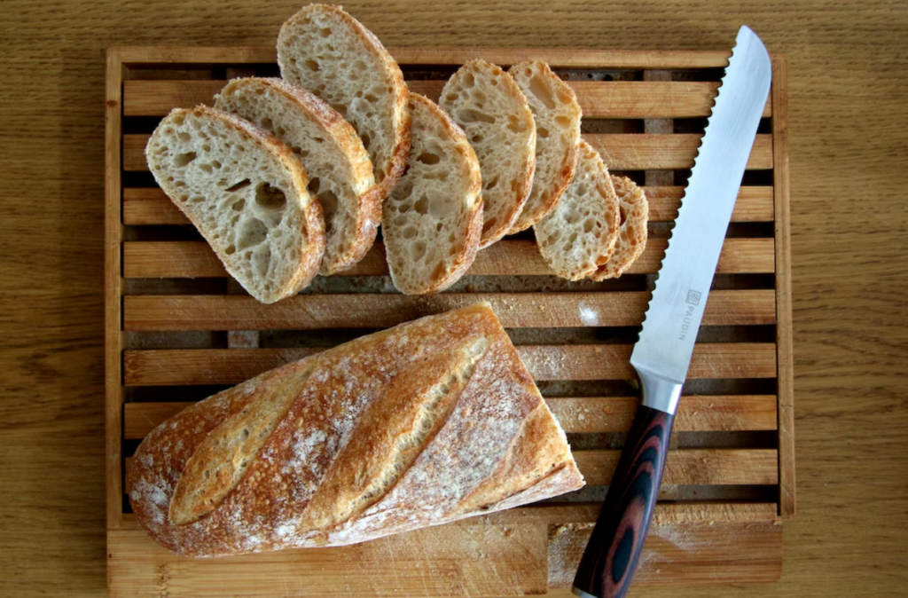 Cutting slices of bread to make grilled bread